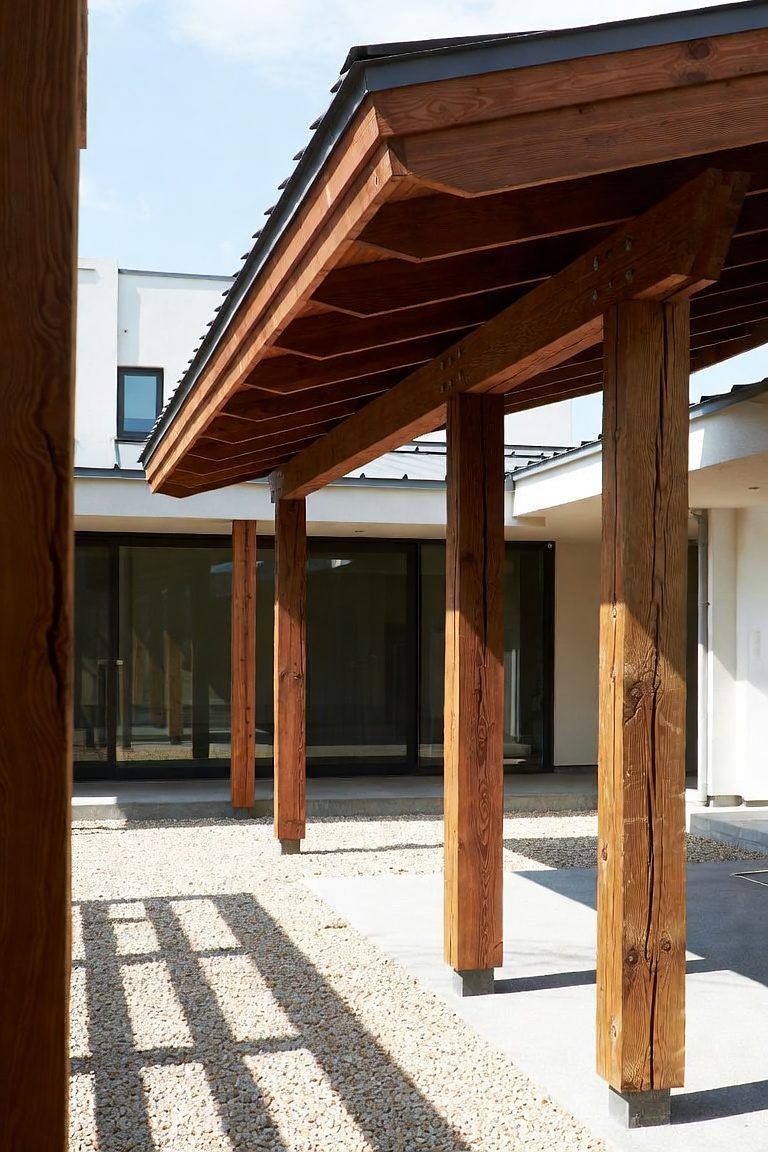 Design rendering of Timber Portico: heavy posts carrying a deep roof